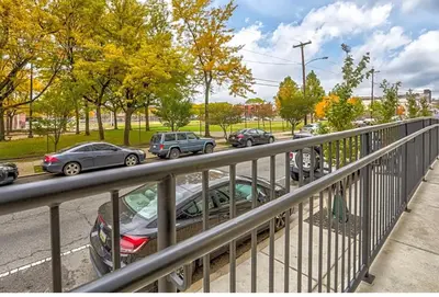 a parking lot with cars parked on a street at Modern NoLibs Studio - Pool & Gym in Philadelphia