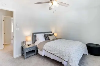 a bedroom with a bed and a ceiling fan at Family fun at Casa Ledges in Tobyhanna
