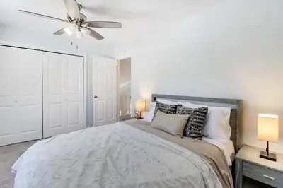a bedroom with a bed and a ceiling fan at Family fun at Casa Ledges in Tobyhanna
