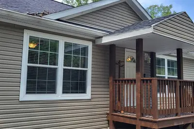 a front porch of a house with a window at Serenity On The Lehigh River in Thornhurst