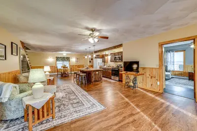 a living room with a couch and a table at Lisle Apt 4 Mi to Dorchester Lake! in Lisle