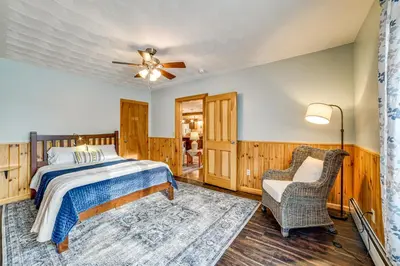 a bedroom with a bed and a ceiling fan at Lisle Apt 4 Mi to Dorchester Lake! in Lisle