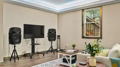 a living room with two speakers and a flat screen tv at Lakeview Sunset Heaven by AvantStay Waterfront Home • Hot Tub Game Room Discounted Ski Tickets in Blakeslee
