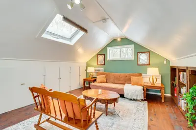 a living room with a couch and a table at 8 Mi to Big Boulder Mountain Cabin with Decks! in Albrightsville