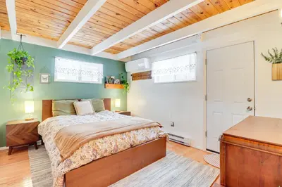 a bedroom with a bed and a wooden ceiling at 8 Mi to Big Boulder Mountain Cabin with Decks! in Albrightsville