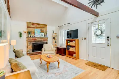 a living room with a couch and a fireplace at 8 Mi to Big Boulder Mountain Cabin with Decks! in Albrightsville