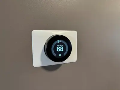 a alarm clock on a wall with a clock on it at NEW Modern Private Entrance 2 BD Apt Minutes to NYC in Jersey City