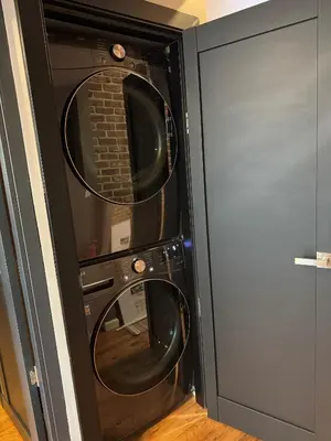 two microwave ovens in a black wall at NEW Modern Private Entrance 2 BD Apt Minutes to NYC in Jersey City