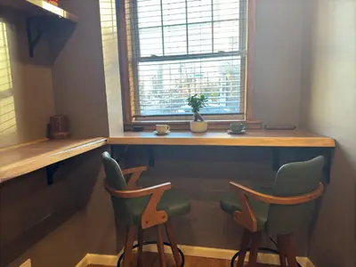 a bar with two chairs and a window in a room at NEW Modern Private Entrance 2 BD Apt Minutes to NYC in Jersey City