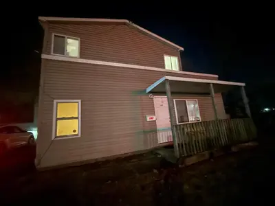 a house at night with the lights on at Cliffwood villa - 4 Bedroom House in Cliffwood Beach