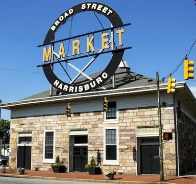 a market sign on the top of a building at BurgBnB Riverfront in Harrisburg