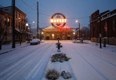 a snow covered street in front of a theater at BurgBnB Riverfront in Harrisburg