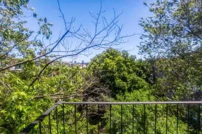 a walkway in a park with trees at Blueground E Village rooftop pool gym ac NYC-1533 in New York