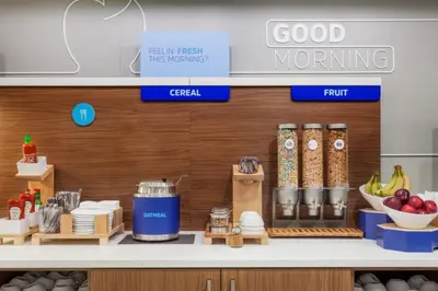 a kitchen with a counter with food on it at Holiday Inn Express & Suites Linden - Newark South by IHG in Linden