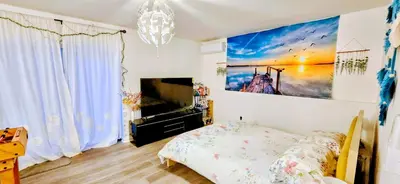a bedroom with a bed and a large painting on the wall at Cozy House in Long Pond 3 bedrooms 10 people in Long Pond