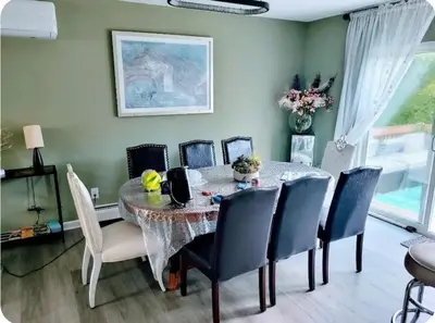 a dining room with a table and chairs at Cozy House in Long Pond 3 bedrooms 10 people in Long Pond
