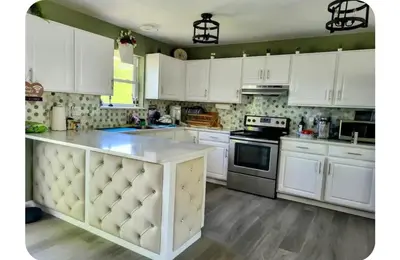 a kitchen with white cabinets and a white counter top at Cozy House in Long Pond 3 bedrooms 10 people in Long Pond