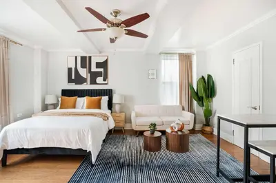 a bedroom with a bed and a ceiling fan at 73-1120 New Studio UWS Doorman Gym in New York