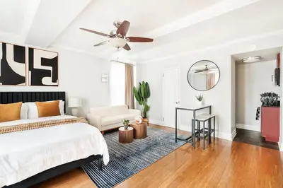 a bedroom with a bed and a ceiling fan at 73-1120 New Studio UWS Doorman Gym in New York
