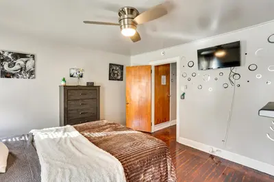 a bedroom with a bed and a tv on the wall at HBG Apt about 3 Mi to Downtown and River! in Harrisburg