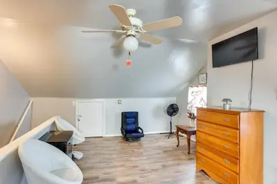 a living room with a ceiling fan and a dresser at HBG Apt about 3 Mi to Downtown and River! in Harrisburg