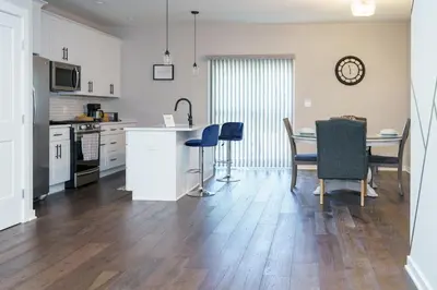 a kitchen and dining room with a table and chairs at Hidden Gem 2 in Norristown