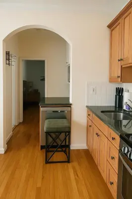 a kitchen with a counter and a sink and a table at 10 Min to NYC Quiet 1BR Flash Deal June 22 to 25 in Weehawken