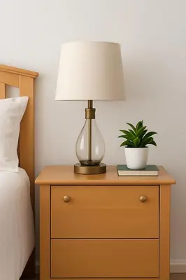 a lamp on a dresser with a plant on it at 10 Min to NYC Quiet 1BR Flash Deal June 22 to 25 in Weehawken