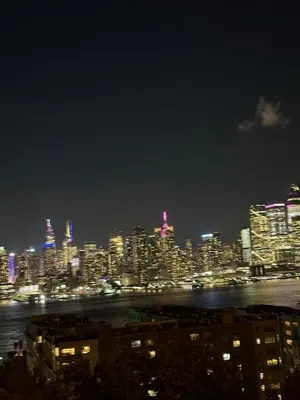 a view of a city at night with lights at 10 Min to NYC Quiet 1BR Flash Deal June 22 to 25 in Weehawken