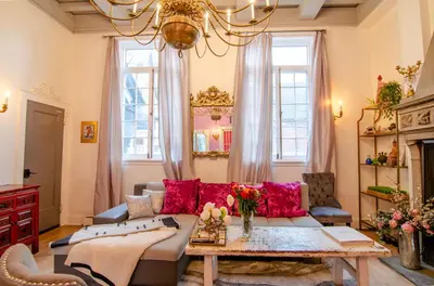 a living room with a couch and a table at One of a kind home with NYC views in Union City