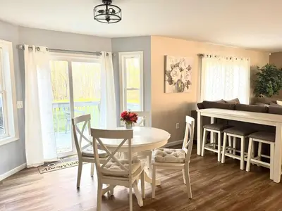 a kitchen and dining room with a table and chairs at Game&GatherLodge in Tobyhanna