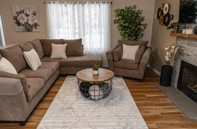 a living room with a couch and a coffee table at Game&GatherLodge in Tobyhanna