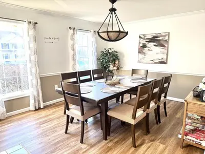 a dining room with a table and chairs at Game&GatherLodge in Tobyhanna