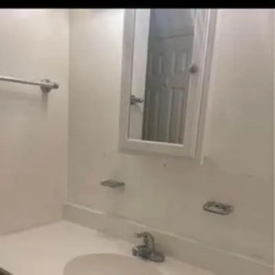 a white bathroom with a sink and a mirror at Sweet Home Near Philadelphia in Hatfield