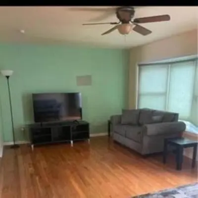 a living room with a couch and a flat screen tv at Sweet Home Near Philadelphia in Hatfield