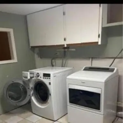 a kitchen with a washing machine and a microwave at Sweet Home Near Philadelphia in Hatfield