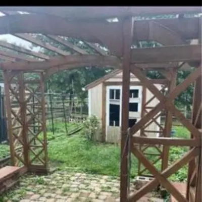 a wooden structure with a small house in the background at Sweet Home Near Philadelphia in Hatfield