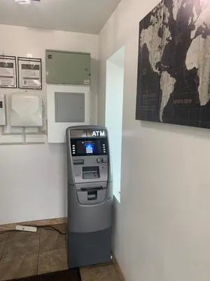 a atm machine in a room with a map on the wall at Westview Motel in North Bergen
