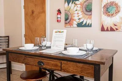 a wooden table with plates and glasses on it at Restaurants Coffee Colleges Bryn Mawr Has It All in Bryn Mawr