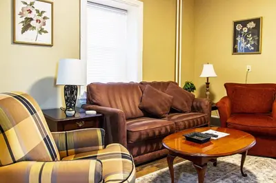 a living room with a couch and a table at Ground-Level 2B2B Apt in Bryn Mawr w Parking in Bryn Mawr