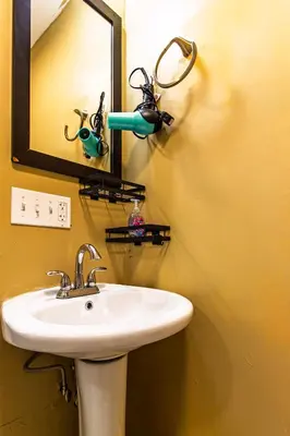 a bathroom with a sink and a mirror at Ground-Level 2B2B Apt in Bryn Mawr w Parking in Bryn Mawr
