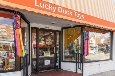 a lucky duck toys store on a city street at 2mins DTPatioParking50 Roku TV400 Mbps in Bryn Mawr