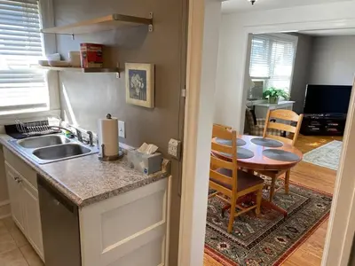 a kitchen with a sink and a table in a room at 2mins DTPatioParking50 Roku TV400 Mbps in Bryn Mawr