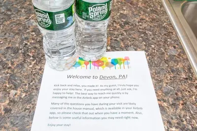 a bottle of water sitting on top of a paper at Off The Beaten Path - Choose This Private Gem in Devon