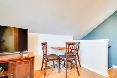 a living room with a table and chairs and a tv at Off The Beaten Path - Choose This Private Gem in Devon