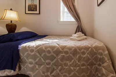 a bedroom with a bed with towels on it at Devon - Horse Show, History, Walk to Shops, Café's in Devon