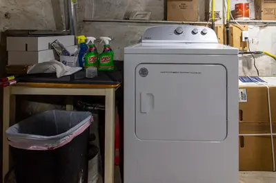 a small refrigerator in a kitchen with a trash can at Devon - Horse Show, History, Walk to Shops, Café's in Devon