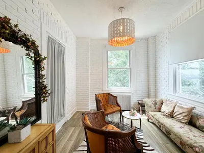 a living room with a couch and a table at NYC views Spacious 3 bedroom apartment in Union City