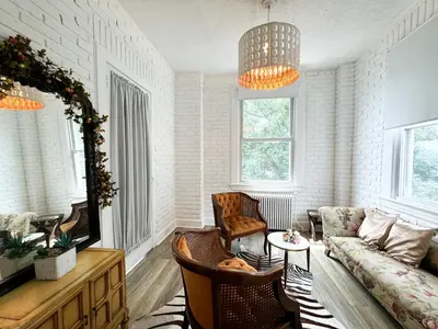 a living room with a couch and a table at NYC views Spacious 3 bedroom apartment in Union City