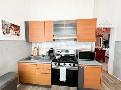 a kitchen with a stove and a sink at NYC views Spacious 3 bedroom apartment in Union City